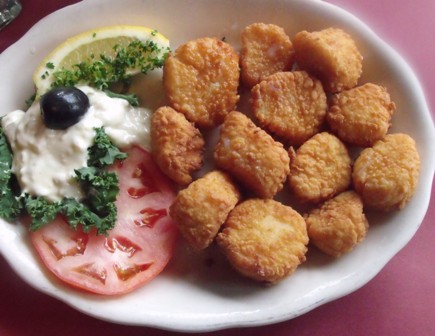 Lightly coated fresh Sea Scallops, fried and served with Tartar Sauce at Mama Leone's.